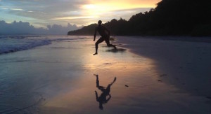 man-jumps-on-beach